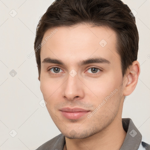 Neutral white young-adult male with short  brown hair and brown eyes