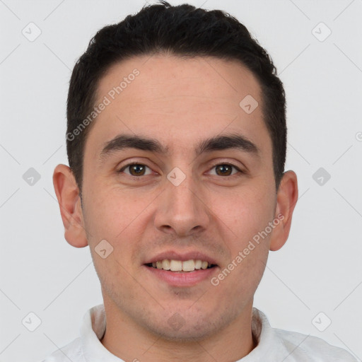 Joyful white young-adult male with short  brown hair and brown eyes