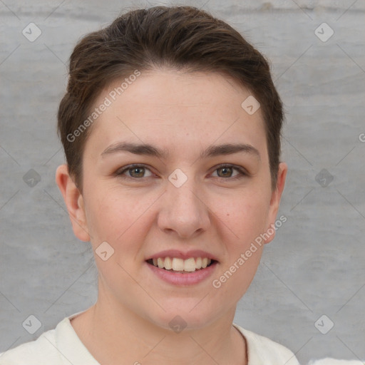 Joyful white young-adult female with short  brown hair and grey eyes