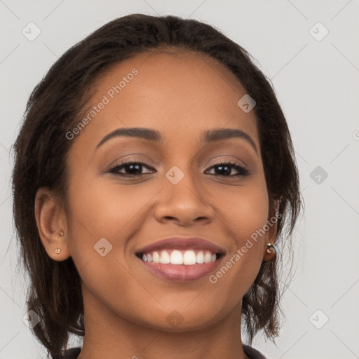 Joyful latino young-adult female with long  brown hair and brown eyes