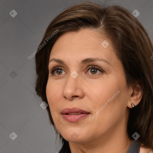 Joyful white adult female with medium  brown hair and brown eyes