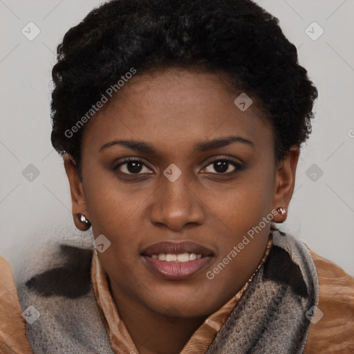 Joyful black young-adult female with short  brown hair and brown eyes