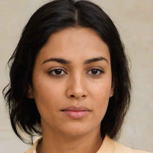 Neutral latino young-adult female with medium  brown hair and brown eyes