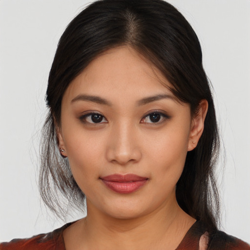 Joyful asian young-adult female with medium  brown hair and brown eyes