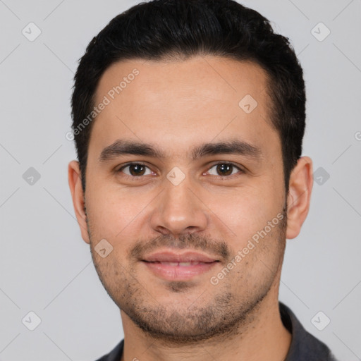 Joyful white young-adult male with short  black hair and brown eyes