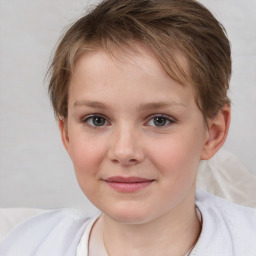 Joyful white child female with medium  brown hair and brown eyes