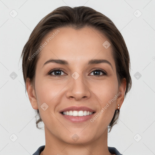 Joyful white young-adult female with short  brown hair and grey eyes