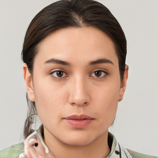 Neutral white young-adult female with medium  brown hair and brown eyes