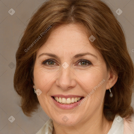 Joyful white adult female with medium  brown hair and green eyes