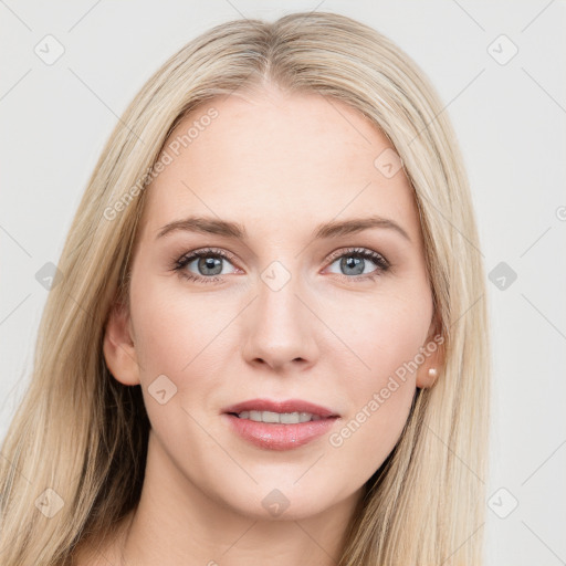 Joyful white young-adult female with long  brown hair and blue eyes