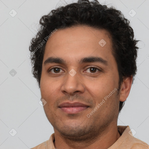 Joyful latino young-adult male with short  brown hair and brown eyes