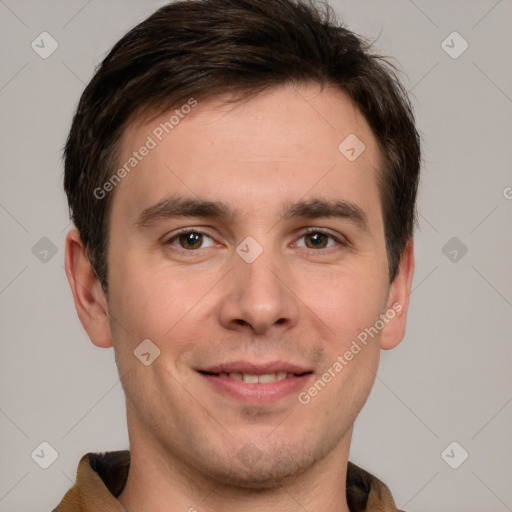 Joyful white young-adult male with short  brown hair and grey eyes