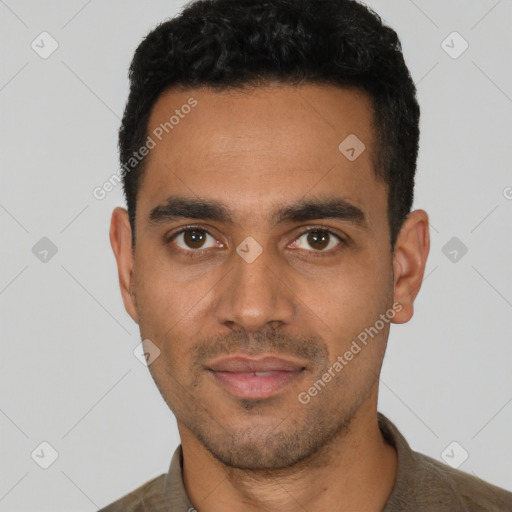 Joyful latino young-adult male with short  black hair and brown eyes