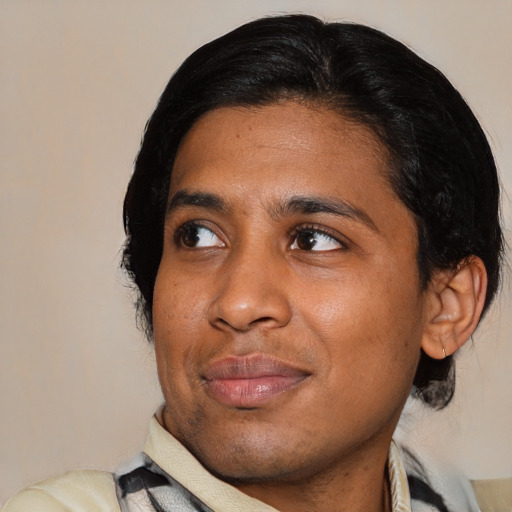 Joyful asian young-adult male with medium  black hair and brown eyes