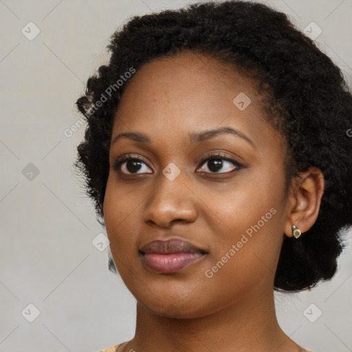 Joyful black young-adult female with medium  black hair and brown eyes