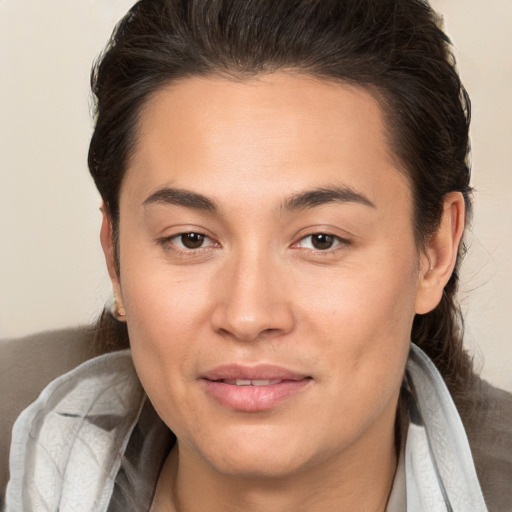 Joyful white young-adult female with medium  brown hair and brown eyes