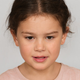 Joyful white child female with short  brown hair and brown eyes