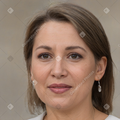 Joyful white adult female with medium  brown hair and grey eyes