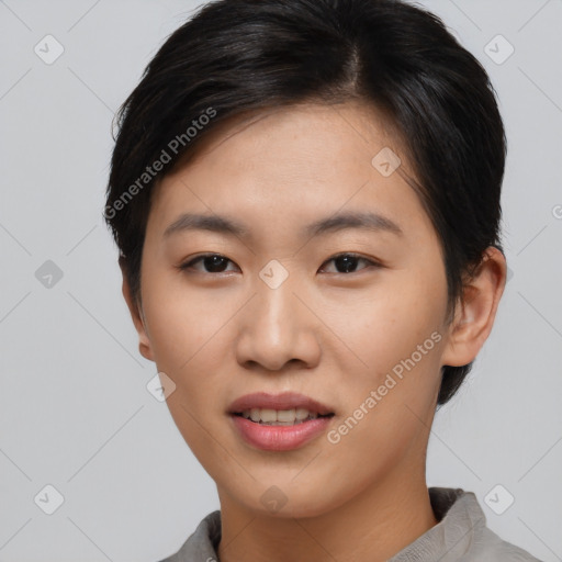 Joyful asian young-adult female with short  black hair and brown eyes