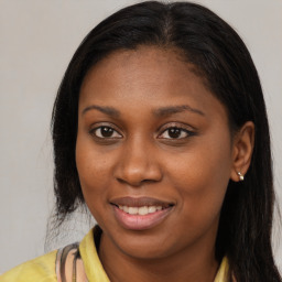 Joyful latino young-adult female with long  brown hair and brown eyes