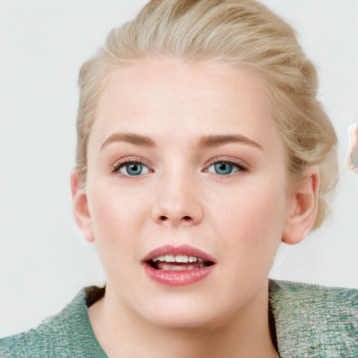 Joyful white young-adult female with short  brown hair and blue eyes