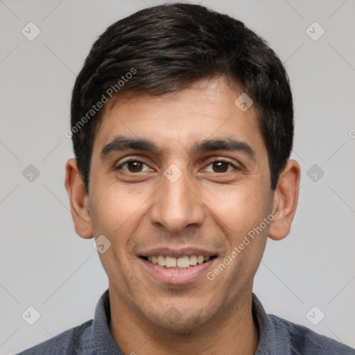 Joyful white young-adult male with short  black hair and brown eyes