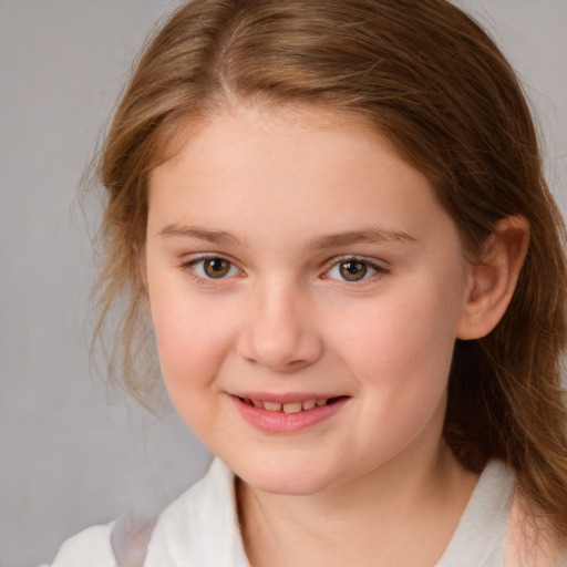 Joyful white child female with medium  brown hair and brown eyes