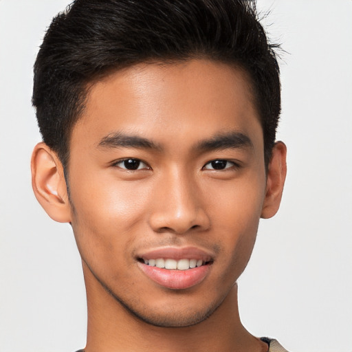 Joyful asian young-adult male with short  brown hair and brown eyes