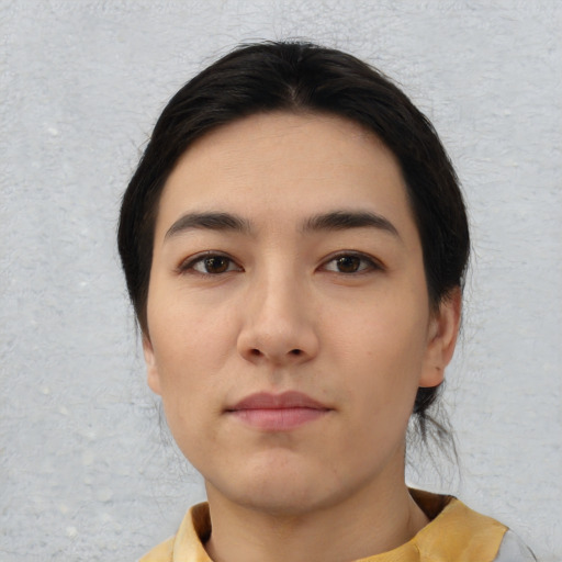 Neutral white young-adult female with short  black hair and brown eyes