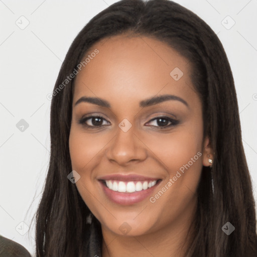 Joyful latino young-adult female with long  black hair and brown eyes