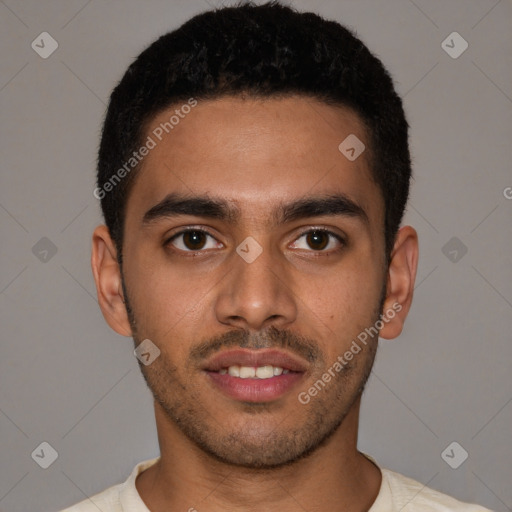 Joyful latino young-adult male with short  brown hair and brown eyes