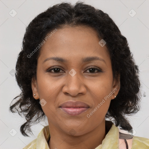 Joyful black adult female with medium  brown hair and brown eyes