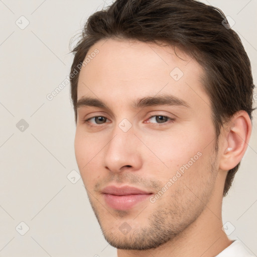 Neutral white young-adult male with short  brown hair and brown eyes