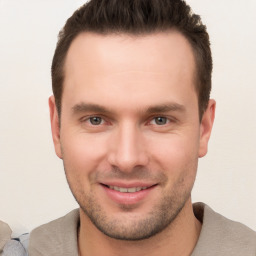 Joyful white young-adult male with short  brown hair and brown eyes