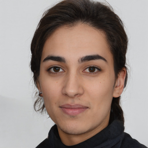 Joyful white young-adult female with medium  brown hair and brown eyes