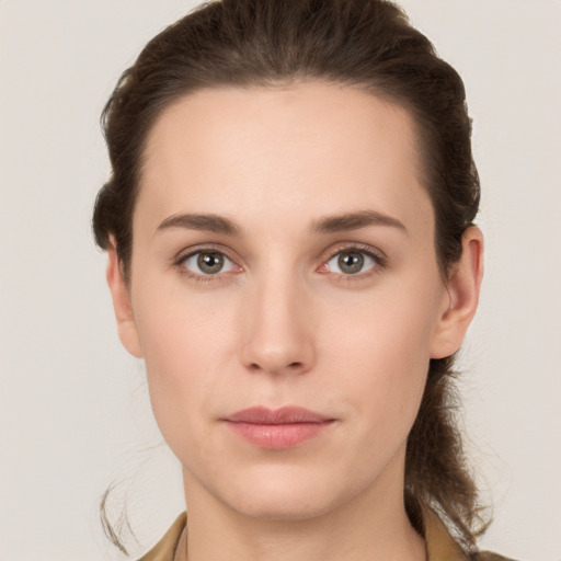 Neutral white young-adult female with long  brown hair and brown eyes