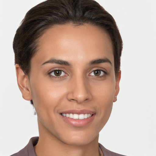 Joyful white young-adult female with short  brown hair and brown eyes