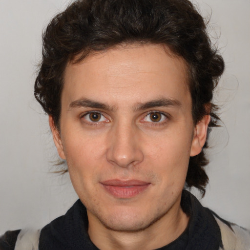 Joyful white young-adult male with medium  brown hair and brown eyes