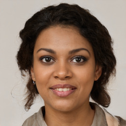 Joyful black young-adult female with medium  brown hair and brown eyes