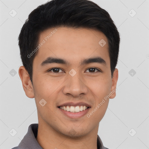 Joyful asian young-adult male with short  black hair and brown eyes