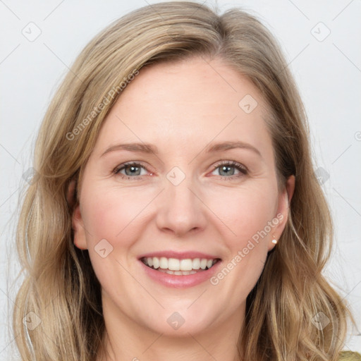 Joyful white young-adult female with long  brown hair and blue eyes