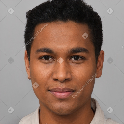 Joyful black young-adult male with short  black hair and brown eyes