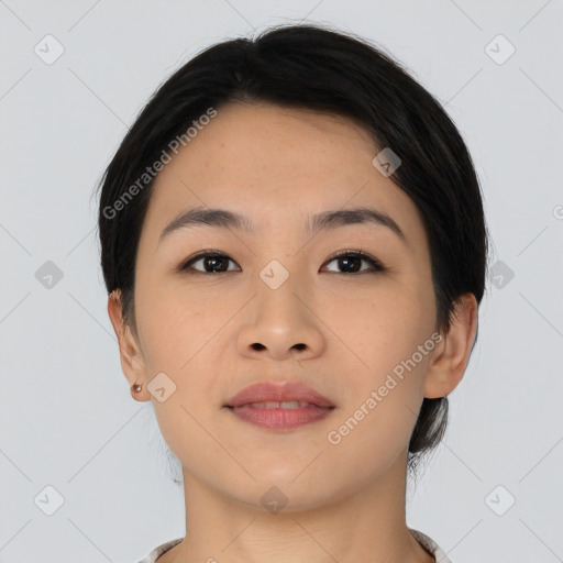 Joyful asian young-adult female with short  brown hair and brown eyes