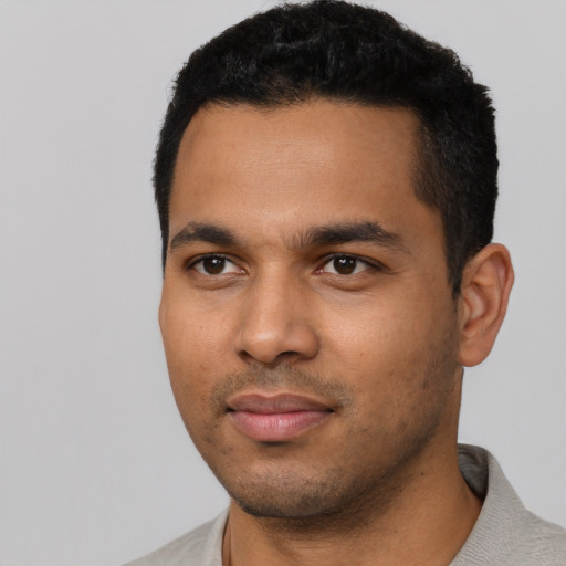 Neutral latino young-adult male with short  black hair and brown eyes