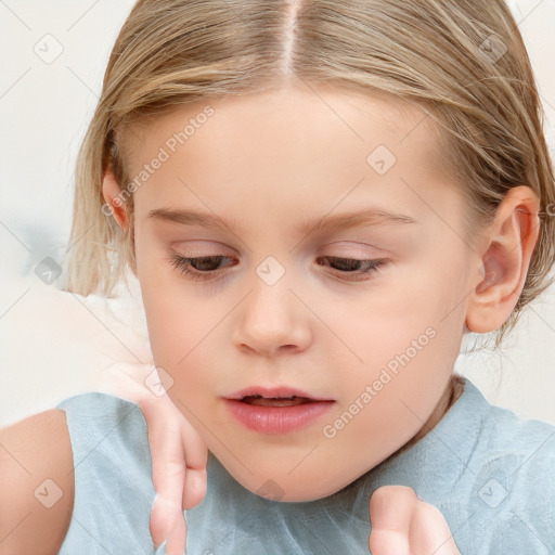 Joyful white child female with medium  brown hair and blue eyes