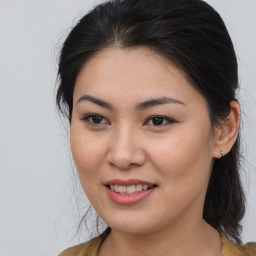 Joyful asian young-adult female with medium  brown hair and brown eyes