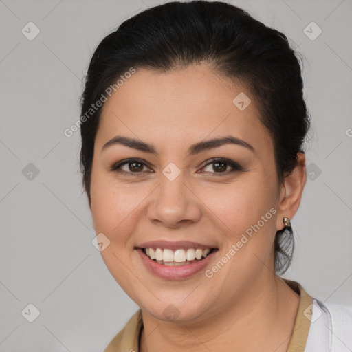 Joyful latino young-adult female with medium  brown hair and brown eyes