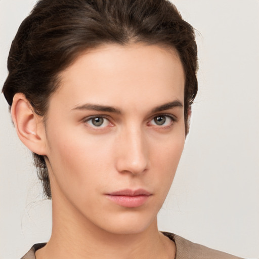 Neutral white young-adult female with short  brown hair and brown eyes