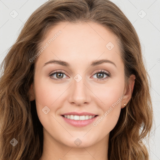 Joyful white young-adult female with long  brown hair and green eyes