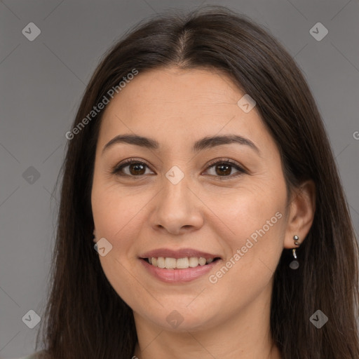 Joyful white young-adult female with long  brown hair and brown eyes